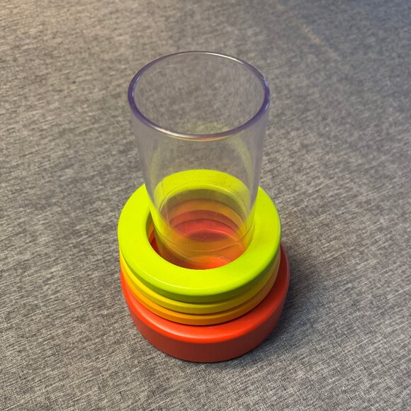 LOVEVERY Clear plastic tube with wooden stacking rings. Age level: 9 mo and up - Picture 1 of 3